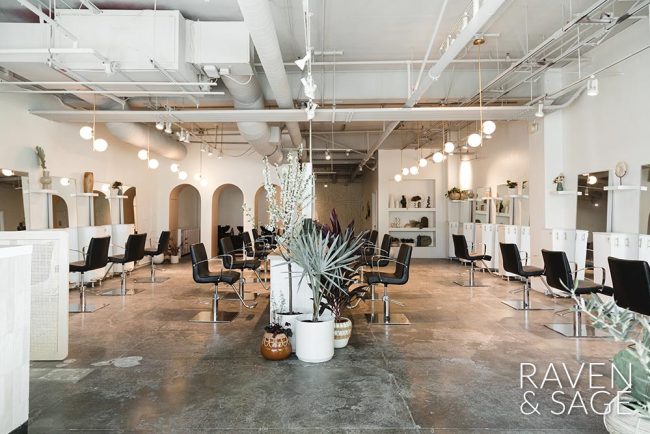 A large, open salon with multiple work stations