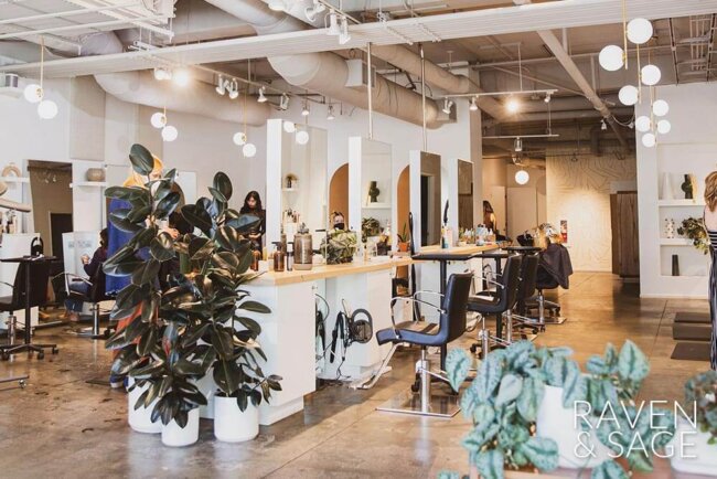 Interior of Raven and Sage Salon, shows hair stations, plants